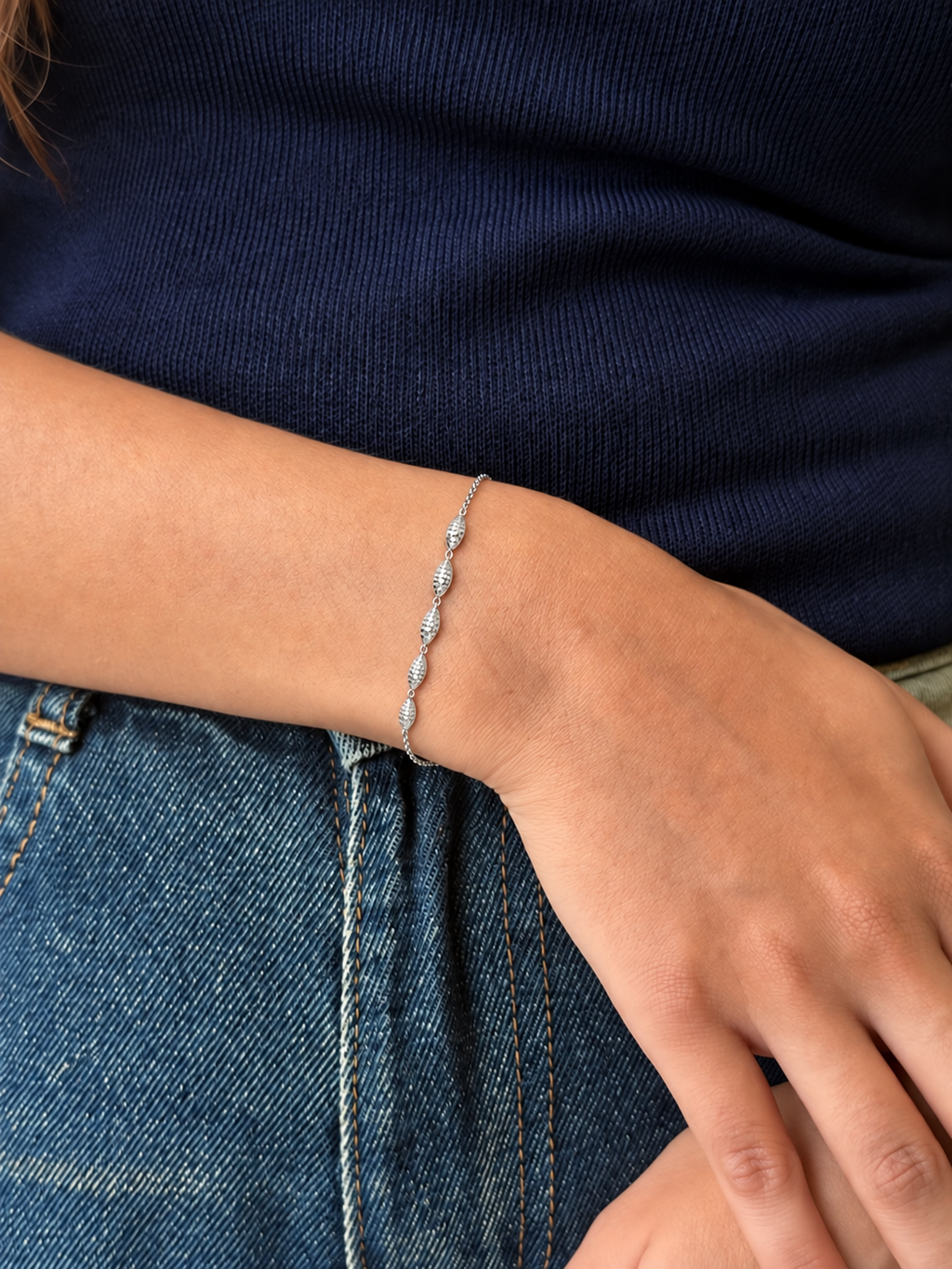 Model wearing silver beads bracelet