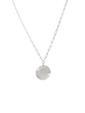 A silver necklace featuring a textured circular disc pendant suspended from a fine link chain, shown against a plain white background.