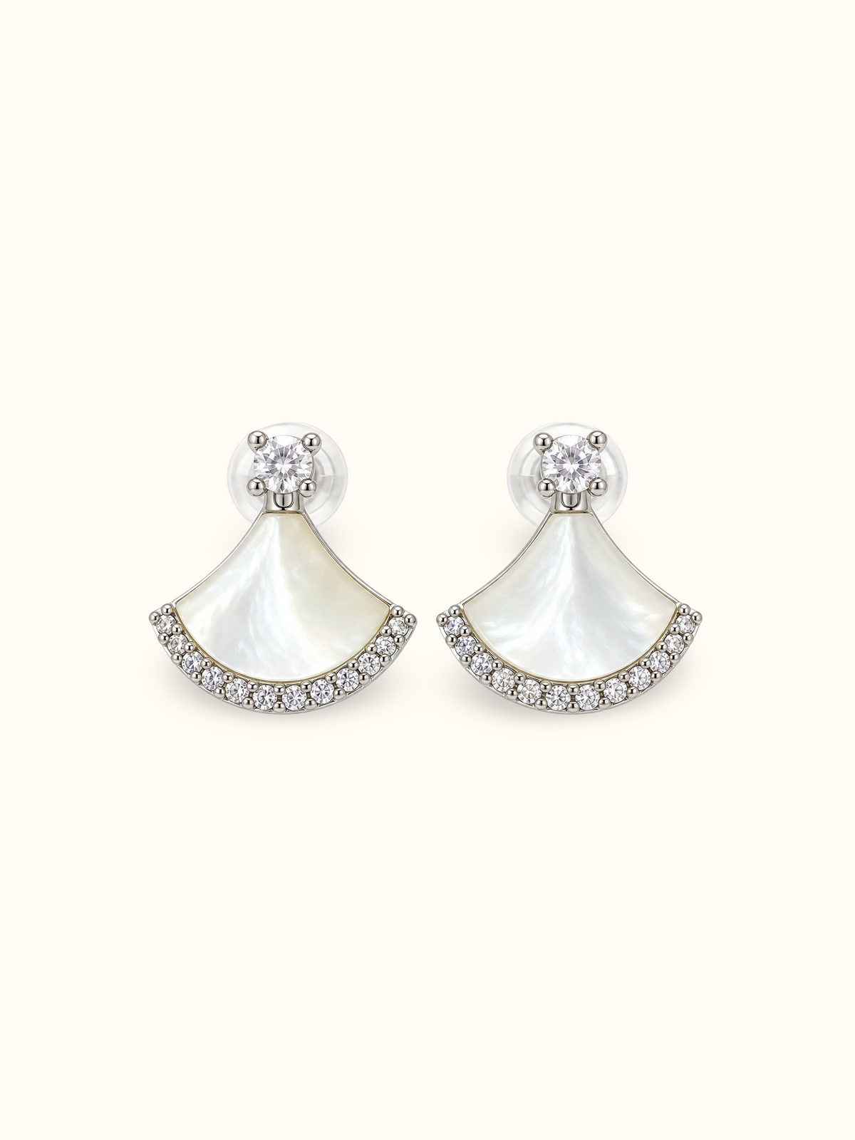 Silver-tone fan-shaped mother-of-pearl drop earrings with clear sparkling stone accents and round crystal studs displayed against a white background.
