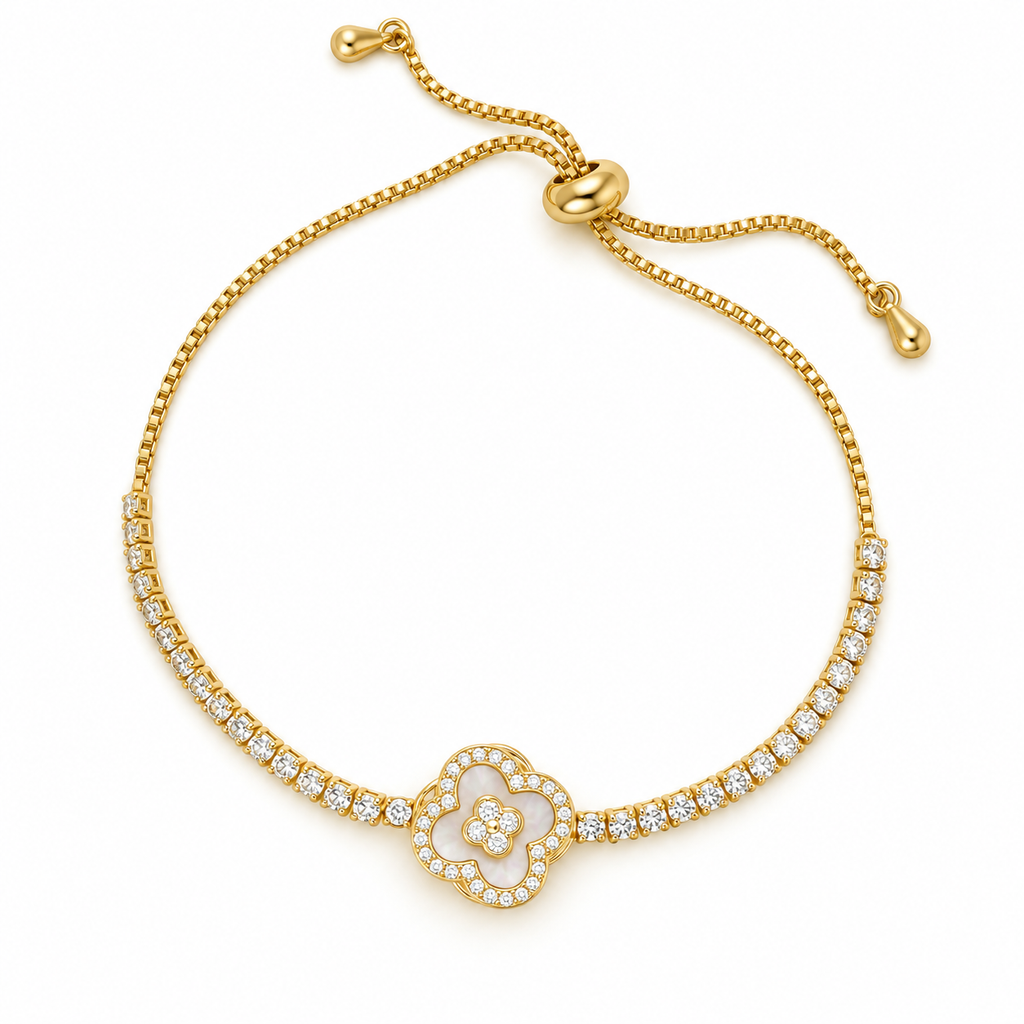 Gold-toned stainless steel slider bracelet featuring a four-leaf clover motif outlined with sparkling white stones and a floral centre.
Delicate gold chain with clear stone accents and an adjustable slider closure, displayed on an off-white background.