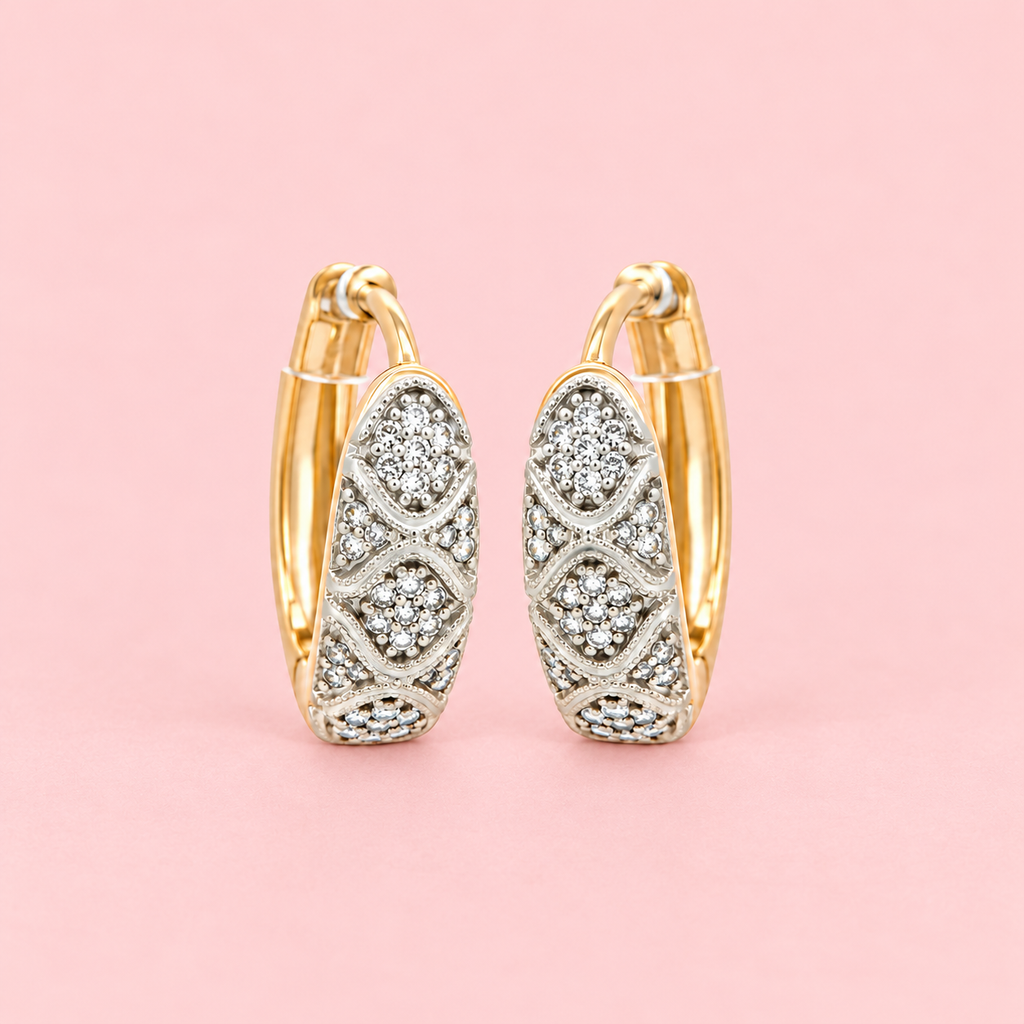 Rose Gold-tone vintage-inspired hoop earrings with clear zircon stones, double oval motifs and intricate detailing displayed against a pink background.