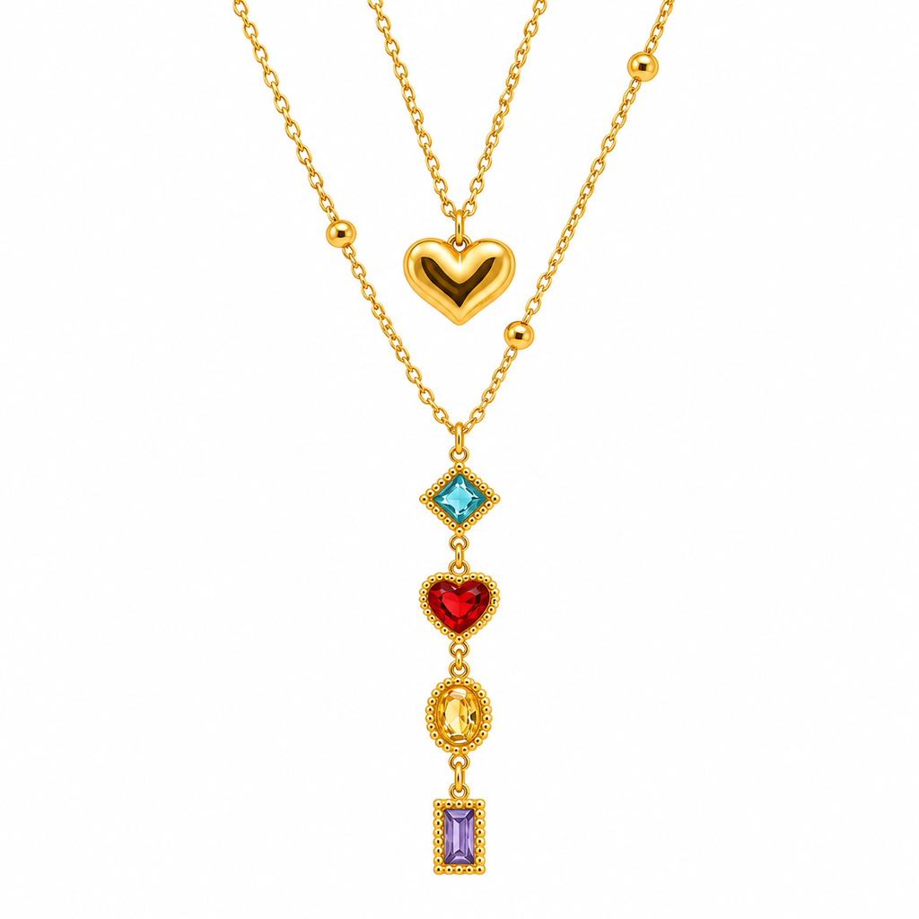 Gold-toned layered necklace with a glossy heart charm and a cascading pendant featuring blue, red, yellow and purple stones.
Colourful statement necklace with decorative gold-toned settings and delicate chains against a light background.