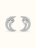Silver crescent moon and star stud earrings with sparkling clear zircons displayed against a white background.