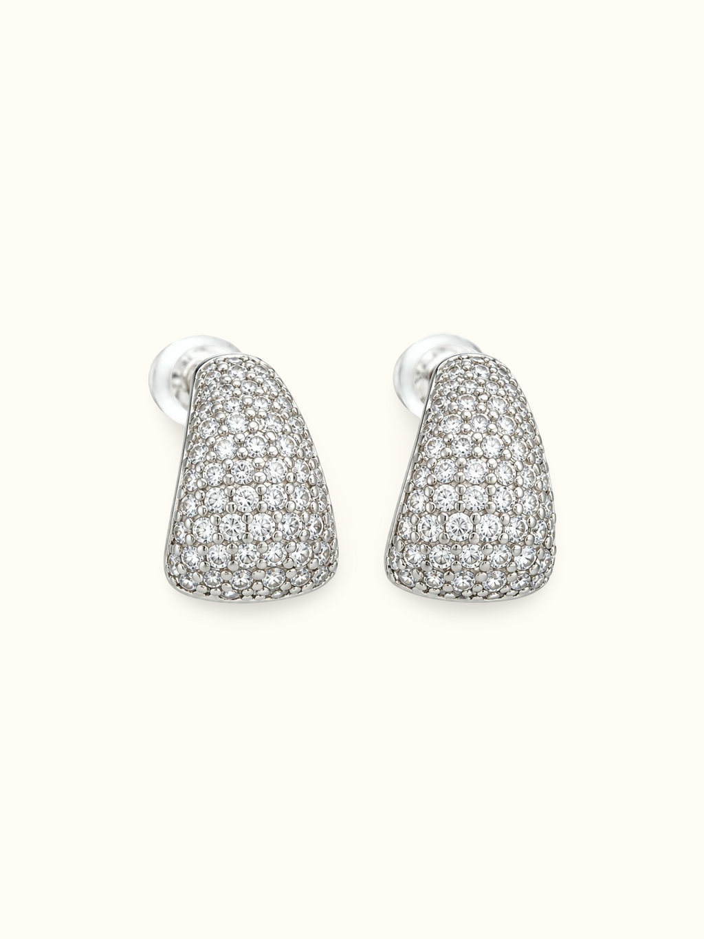 Silver-tone teardrop stud earrings with pavé-style white stones and a polished finish displayed against a white background.