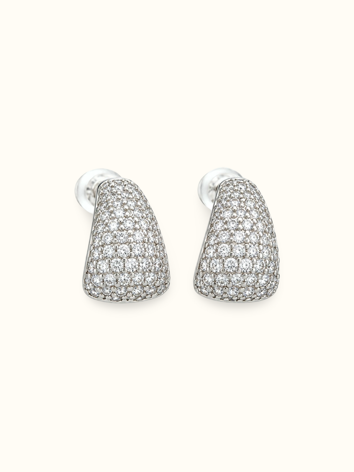 Silver-tone teardrop stud earrings with pavé-style white stones and a polished finish displayed against a white background.