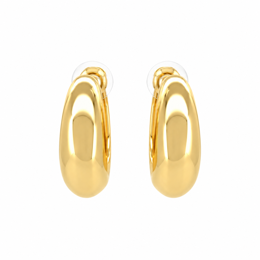 Gold-tone chunky huggie hoop earrings with a smooth, rounded shape and polished finish.