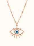 Rose gold-tone evil eye pendant necklace with a blue eye centre and delicate chain displayed against a white background