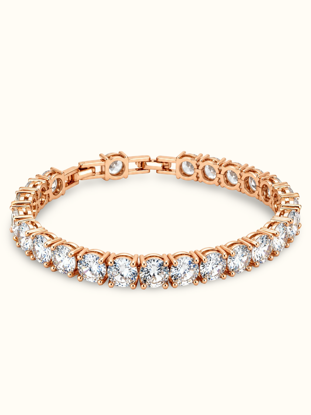 Rose gold-toned tennis bracelet featuring a continuous row of brilliant round-cut clear stones in prong-style settings.
Classic linked bracelet design with a sparkling finish, displayed on a clean off-white background.