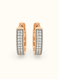 Rose gold-tone hoop earrings with clear sparkling stones and a dark textured base displayed against a white background.