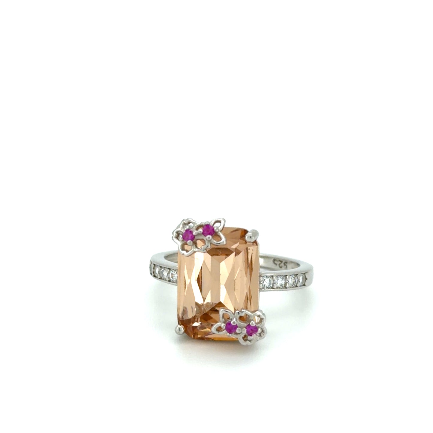 Sunset Blossom Solitaire Ring with a large orange gemstone and smaller pink stones on a white background