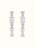 Silver-tone geometric drop earrings with round, marquise, rectangular and pear-shaped clear stones displayed against a white background.