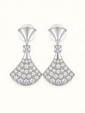 Silver-tone fan drop earrings embellished with clear sparkling stones and polished geometric detailing on a white background.