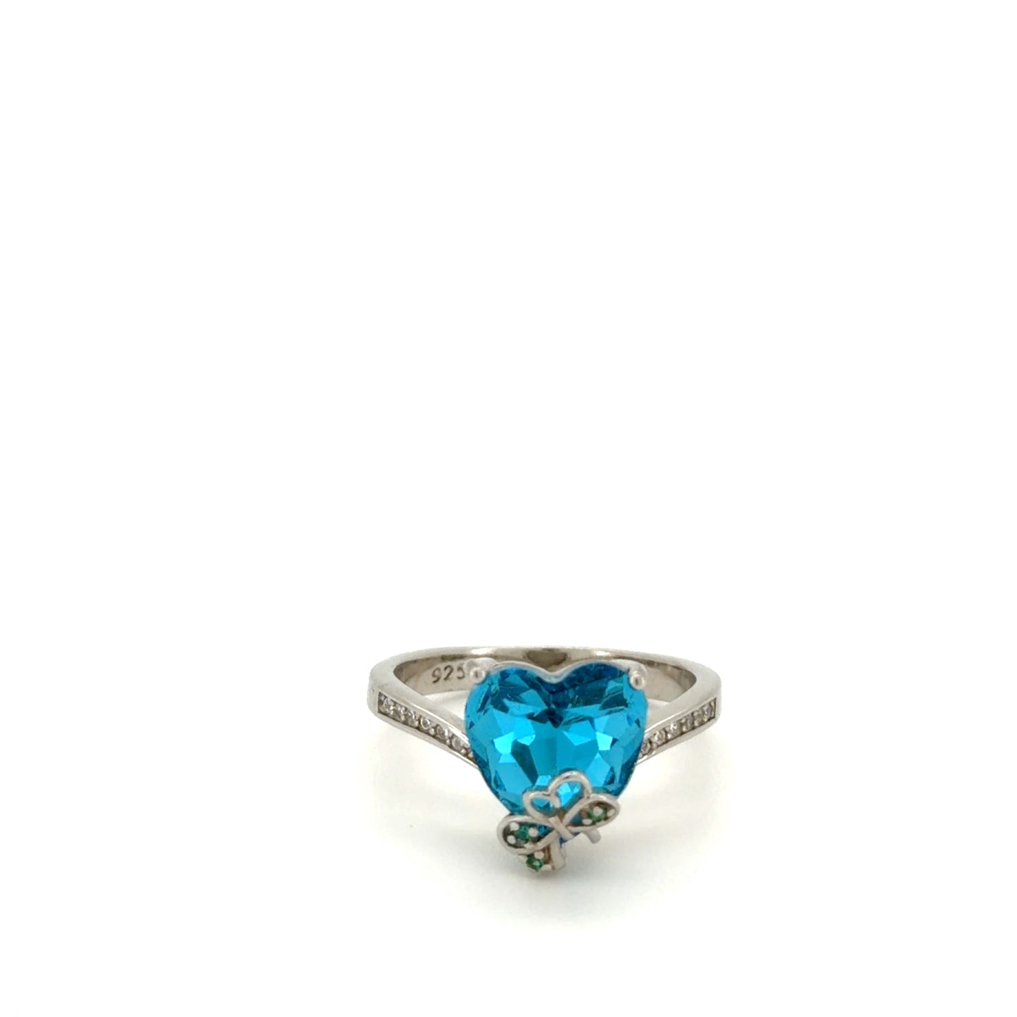 maela Ring with a blue heart-shaped gemstone on a white background