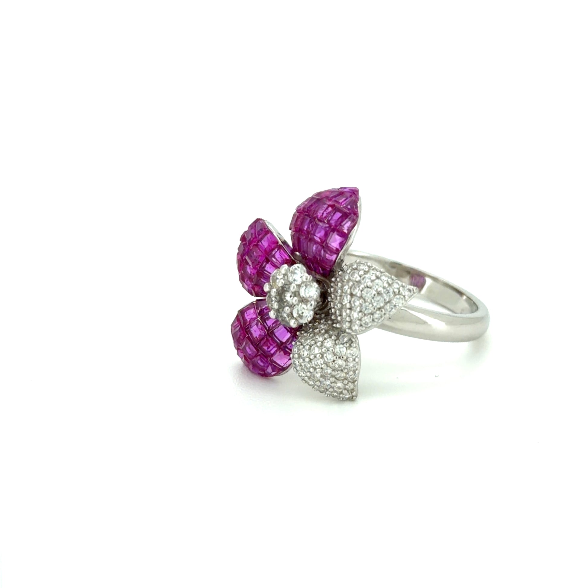 Silver blossom brilliance ring
 ring with pink gemstones on a white background