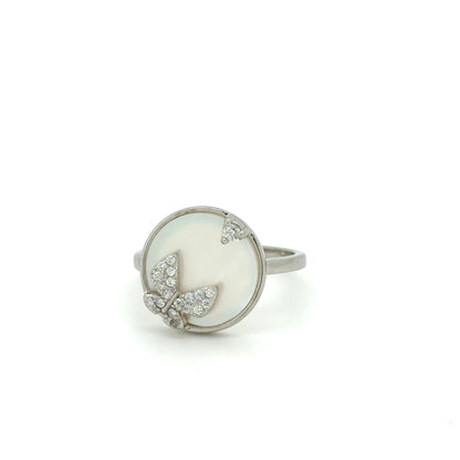Silver ring with a white stone and leaf design on a white background