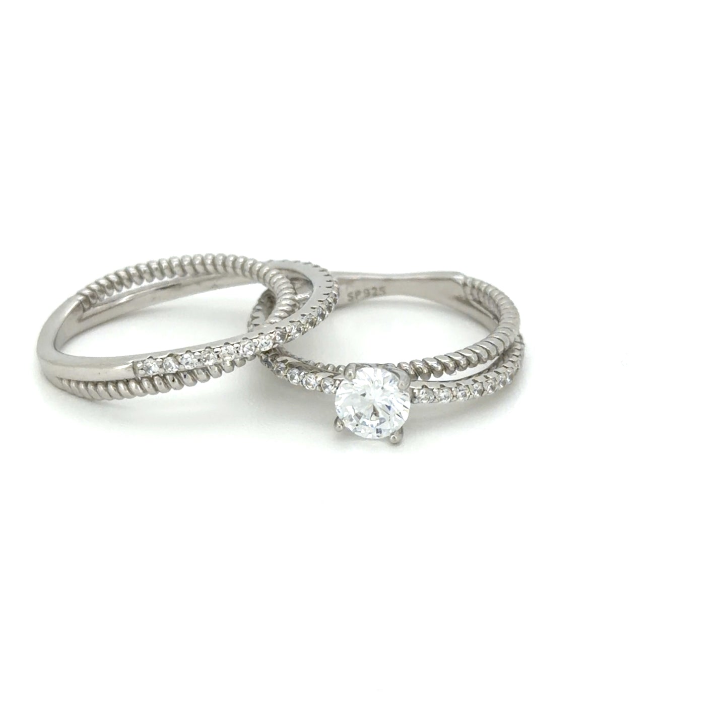 Two silver rings with diamond accents on a white background