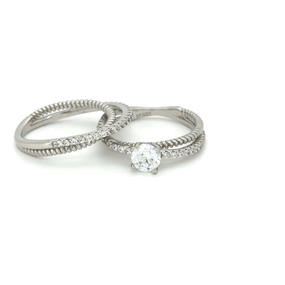 Two silver rings with diamond accents on a white background