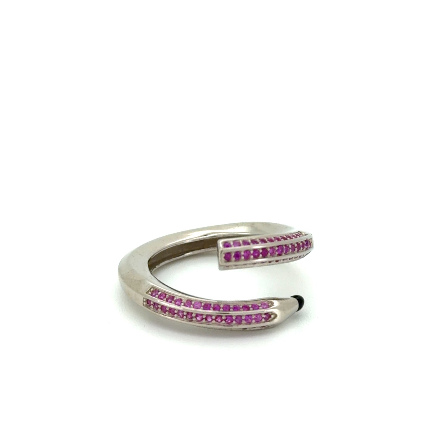 Silver ring with pink gemstones on a white background