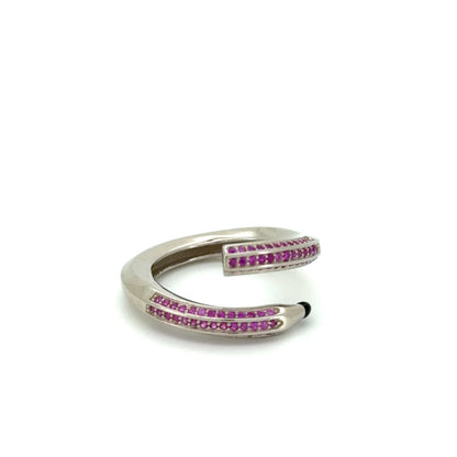 Silver ring with pink gemstones on a white background