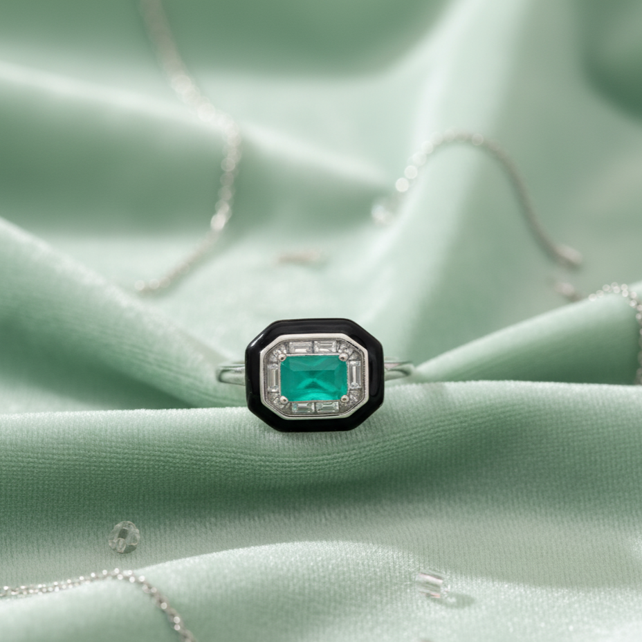 Black enamel border framing emerald crystal in Midnight Emerald Grandeur Ring