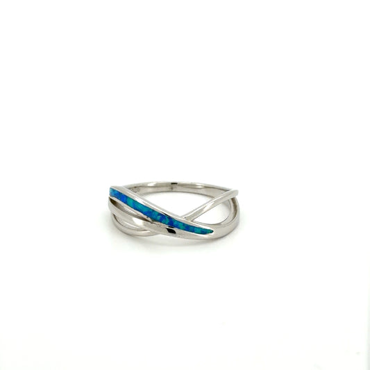 Silver ring with blue inlay on a white background