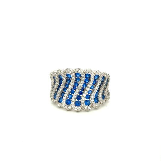 ocean current ring with blue gemstones on a white background