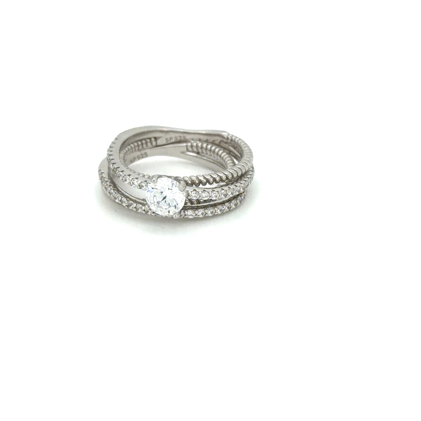 Stack of silver rings with a diamond on a white background